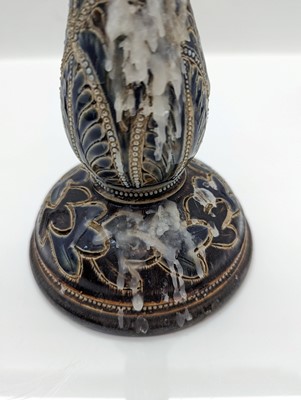 Lot 141 - A pair of Doulton Lambeth stoneware candlesticks