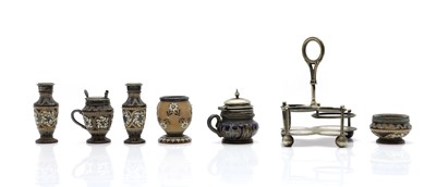 Lot 134 - A Doulton Lambeth stoneware four piece condiment set