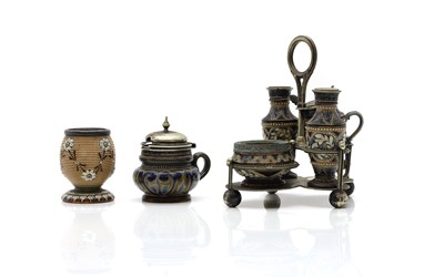 Lot 134 - A Doulton Lambeth stoneware four piece condiment set