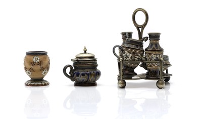 Lot 134 - A Doulton Lambeth stoneware four piece condiment set