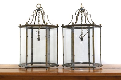 Lot 379 - A pair of George III style hall brass lanterns