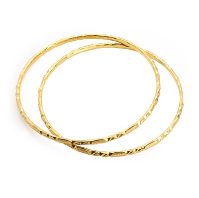 Lot 325 - Two high carat gold bangles