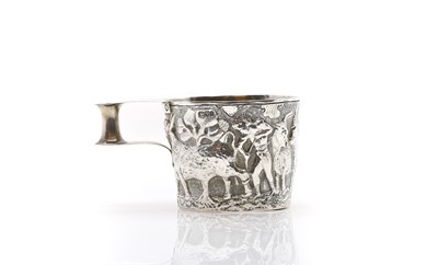 Lot 23 - A silver repousse mug