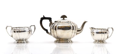 Lot 17 - A silver three piece tea service