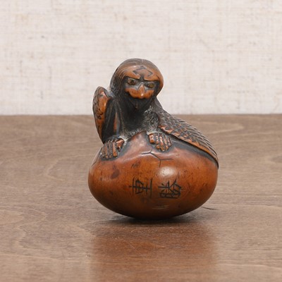 Lot 216 - A Japanese wood netsuke