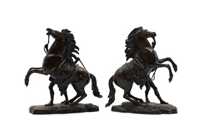 Lot 220 - A pair of patinated bronze sculptures