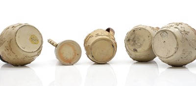 Lot 142 - A group of four salt glazed stoneware 'Harvest' jugs