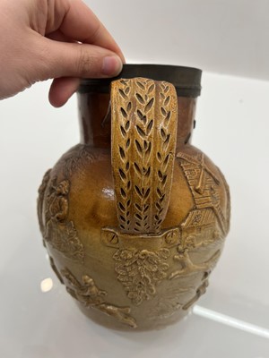 Lot 142 - A group of four salt glazed stoneware 'Harvest' jugs
