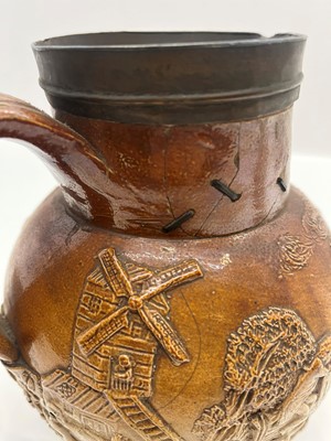 Lot 142 - A group of four salt glazed stoneware 'Harvest' jugs