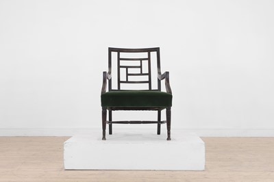 Lot 62 - An Aesthetic Period ebonised walnut elbow chair in the manner of E W Godwin