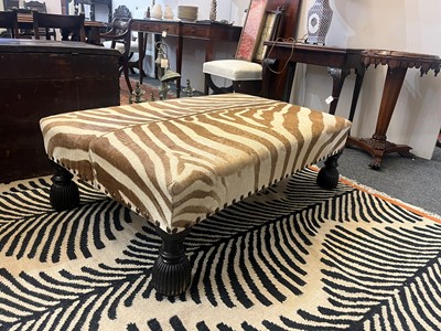 Lot 63 - A stained wood and zebra skin stool