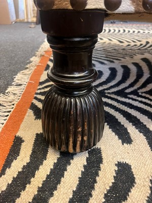 Lot 63 - A stained wood and zebra skin stool