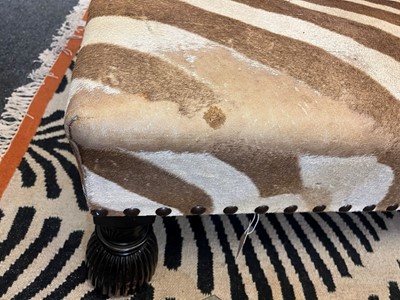 Lot 63 - A stained wood and zebra skin stool