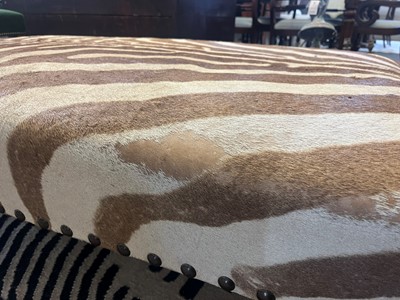 Lot 63 - A stained wood and zebra skin stool