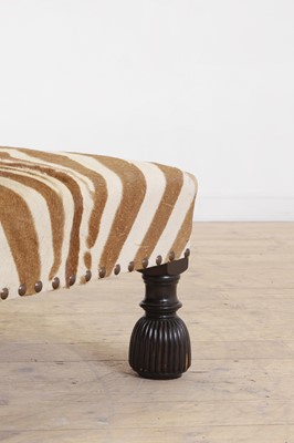 Lot 63 - A stained wood and zebra skin stool