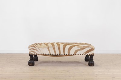 Lot 63 - A stained wood and zebra skin stool