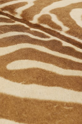 Lot 63 - A stained wood and zebra skin stool