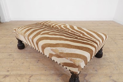 Lot 63 - A stained wood and zebra skin stool