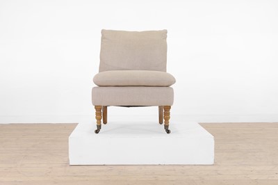 Lot 7 - An upholstered nursing chair by OKA