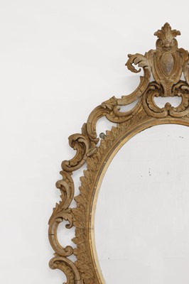 Lot 83 - A carved giltwood oval mirror