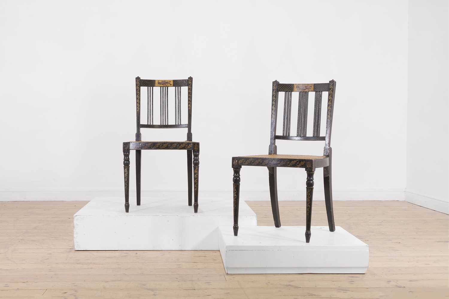 Lot 66 - A pair of George III ebonised and painted wooden side chairs