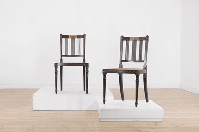 Lot 66 - A pair of George III ebonised and painted wooden side chairs