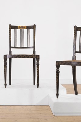 Lot 66 - A pair of George III ebonised and painted wooden side chairs
