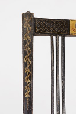 Lot 66 - A pair of George III ebonised and painted wooden side chairs