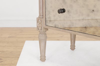 Lot 24 - A painted wooden and verre églomisé chest of drawers by OKA