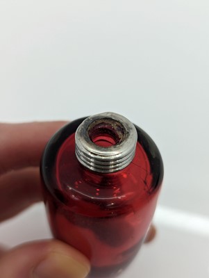 Lot 41 - A Victorian silver-mounted glass scent bottle