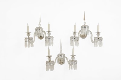 Lot 137 - A set of three cut-glass wall lights