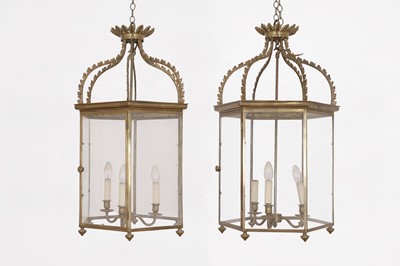 Lot 111 - A pair of George III-style brass and glass hall lanterns