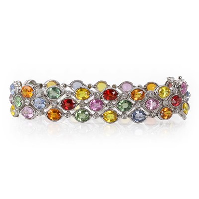 Lot 197 - A white gold, three row varicoloured sapphire and diamond bracelet