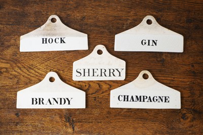 Lot 130 - A group of five ceramic wine bin labels