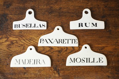 Lot 131 - A group of five ceramic wine bin labels