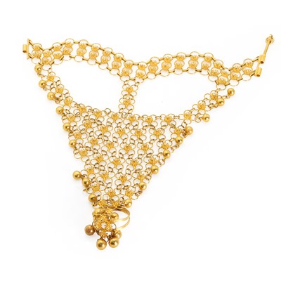 Lot 209 - A Middle Eastern gold dorsal hand ornament