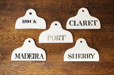 Lot 132 - A matched set of five ceramic wine bin labels