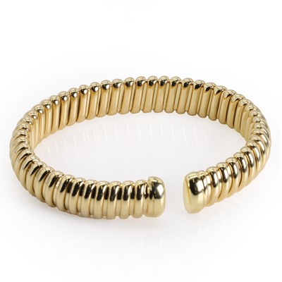 Lot 128 - An 18ct gold torque bangle, by Mappin & Webb