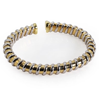 Lot 129 - An 18ct bi-colour gold torque bangle