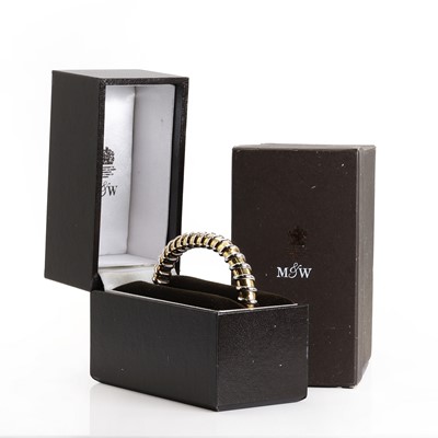 Lot 129 - An 18ct bi-colour gold torque bangle