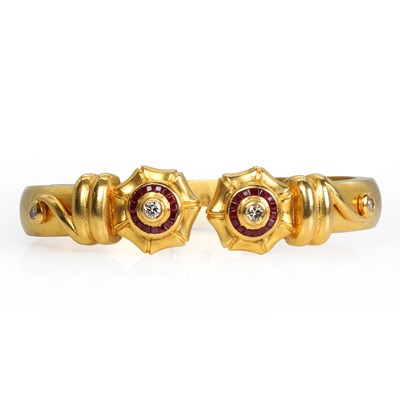 Lot 244 - A ruby and diamond torque bangle