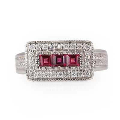 Lot 233 - A white gold diamond and rhodolite garnet ring
