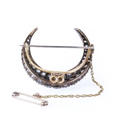 Lot 23 - A late Victorian two row diamond closed crescent brooch, c.1890