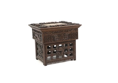 Lot 496 - A Chinese carved hardwood games table