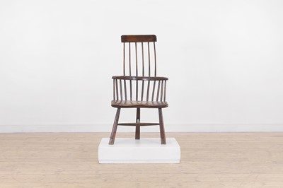Lot 506 - A small ash and elm comb-back Windsor chair
