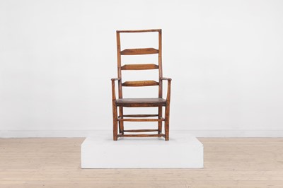 Lot 510 - A vernacular elm ladder-back open armchair