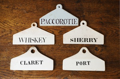 Lot 129 - A group of five ceramic wine bin labels