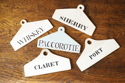 Lot 129 - A group of five ceramic wine bin labels
