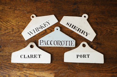 Lot 129 - A group of five ceramic wine bin labels