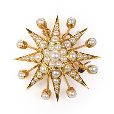 Lot 30 - An Edwardian gold and pearl starburst brooch